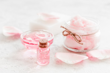 Obraz na płótnie Canvas rose organic cosmetics with salt, cream and oil on white table background
