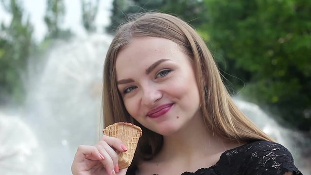 Beautiful young girl eating ice cream
