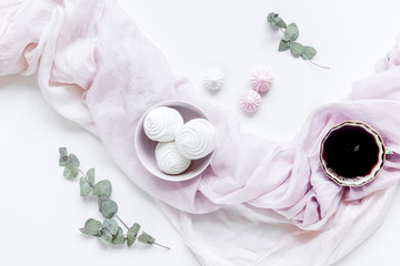 woman lunch with marsh-mallow, coffee and flowers soft light on white table background flat lay