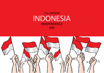 Hands holding a red and white Indonesian flag. Independence day celebration of indonesia.