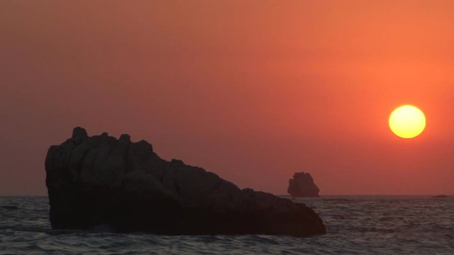 Sun begins to set over the Mediterranean Sea