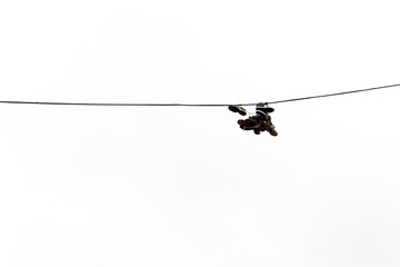 Boots Hanging on Electricty Cable