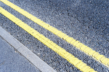 Fototapeta premium Double Yellow Painted No Parking Traffic Lines
