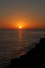 Fototapeta na wymiar Orange Sunset at Mission Beach Jetty