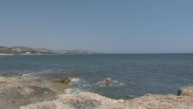 Waves crash into rocks off the coast of Cyprus