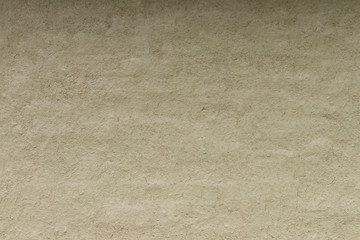 Rough cement wall surface.