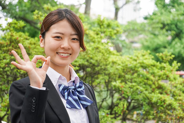Student waving her hands with smile