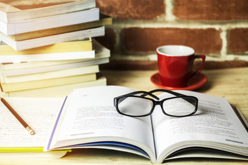 Fototapeta premium Reading glasses on the table