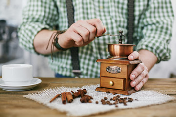 Closeup shot of man making cup of fresh black coffee