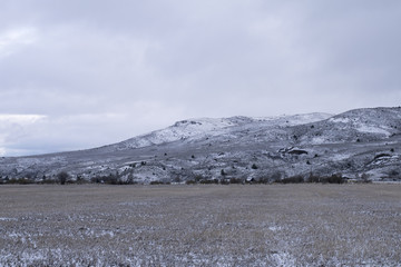 Snow dusted field and hills