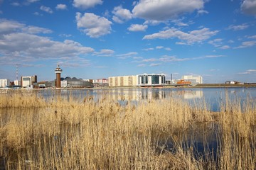 Panorama of the city with a lake.