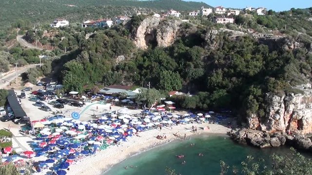 BUYUK CAKIL BEACH, KAS, TURKEY &ndash; August 20, 2013: Beach in bay and village above