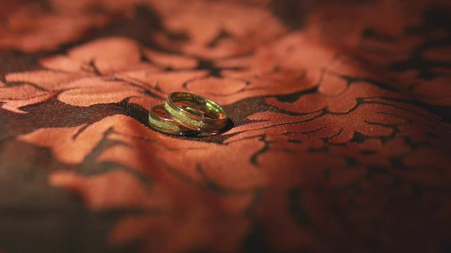 Wedding Rings on Bed