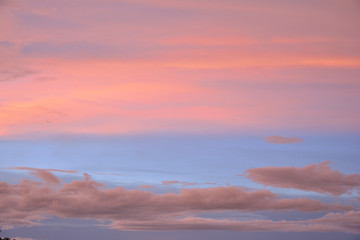 Colorful clouds on blue sky with sunrise.