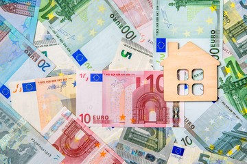 The symbol of the house lies on the background of the Euro 