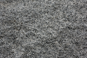 Closeup of grey granite texture background.