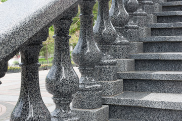 Granite ladder with figured handrail, granite stairs. - obrazy, fototapety, plakaty