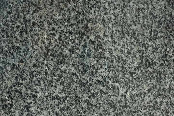 Closeup of grey granite texture background.
