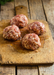  Meatballs - minced meat in the form of balls on the kitchen board