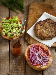  Burger - the process of cooking, on a wooden surface