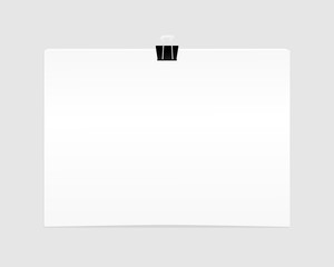 Blank empty sheet of paper attached with clip isolated on white background.