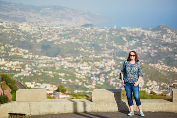 Fototapeta na wymiar Tourist at Mirador de Cabo Girao on Madeira island, Portugal