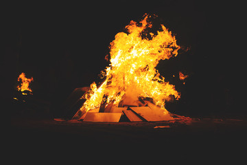 Big orange bonfire with a dark background