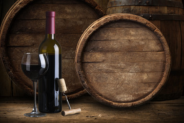 Closeup of red wine pouring in glass