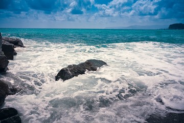 Wawe splashes sea storm horizon
