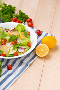 Homemade fresh green vegetable salad on table.