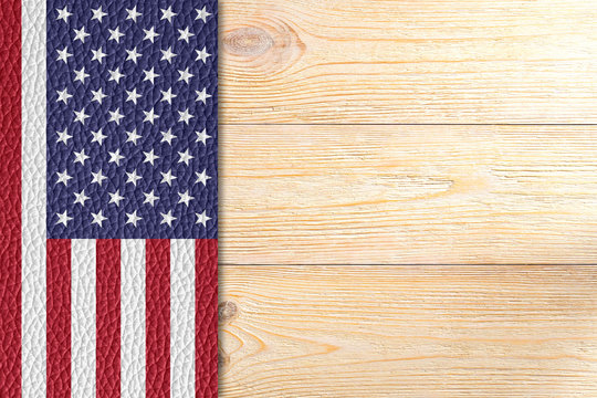 texured united states flag over wooden planks