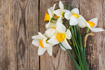 Bouquet of daffodils on wooden background