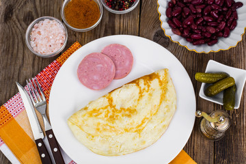 Tasty omelette and chicken ham for breakfast