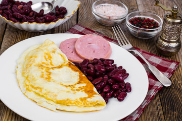 Tasty omelette and chicken ham for breakfast