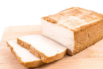 Slices tofu  on a cutting board