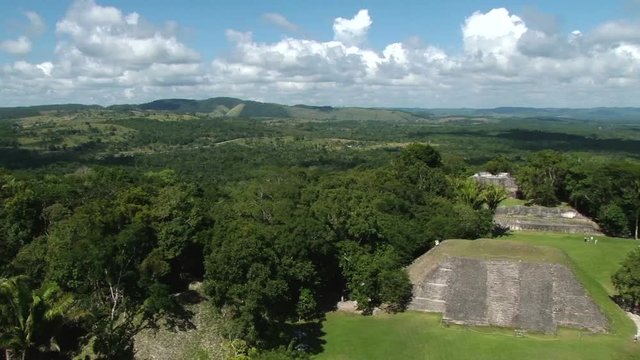 Pan across from left to right from the top of temple El Castillo at Xunantunich archaeological site in Belize