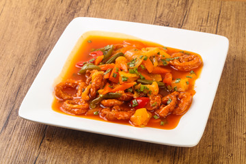 Squid rings in sweet and sour sauce with vegetables