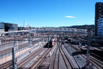 Passenger train passed modern city area of Bjorvika place in Oslo - Norway.