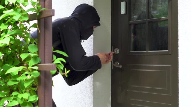 house robbery - robber break door lock and entering building