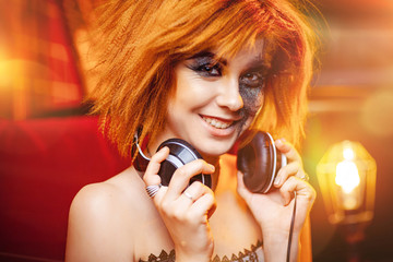 Girl in headphones at the disco