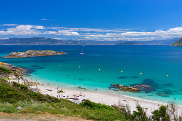 Spain, Galicia, Cies Islands. Views over the Nosa Señora Beach with clear blue water. - obrazy, fototapety, plakaty