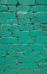 old brick wall painted in green color