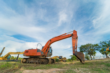 Close-up of a construction site excavator with blue sky