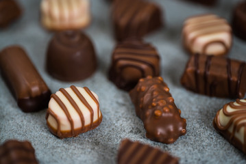 Variety of sweet homemade chocolate pralines and chocolate bars