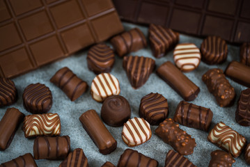 Variety of sweet homemade chocolate pralines and chocolate bars