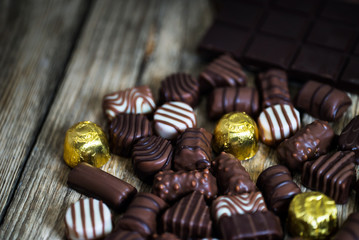 Variety of sweet homemade chocolate pralines and chocolate bars