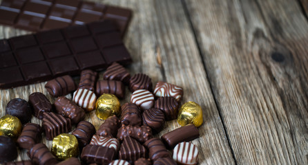 Variety of sweet homemade chocolate pralines and chocolate bars