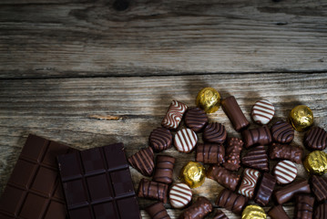Variety of sweet homemade chocolate pralines and chocolate bars