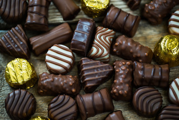 Variety of sweet homemade chocolate pralines and chocolate bars