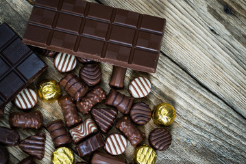 Variety of sweet homemade chocolate pralines and chocolate bars